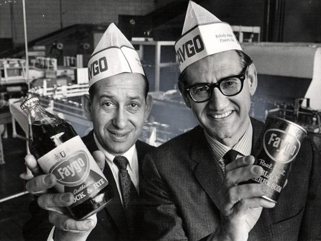 Cousins Morton Feigenson and Phillip Feigenson holding up Faygo beverages